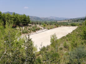 Photo of Heraion in Perachora with small beach, Loutraki, Greece.