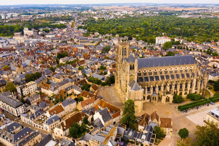 Scenic aerial view of Bourges town and surroundings in summer overlooking Gothic building of Roman Catholic Cathedral, France..