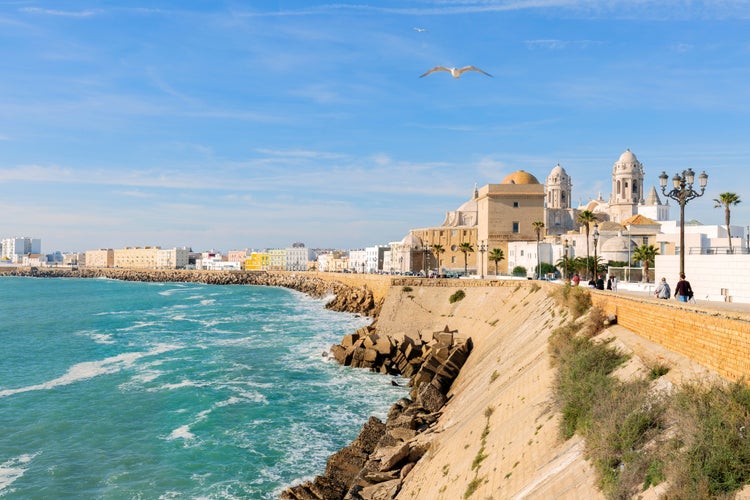 Beautiful view at day of the cathedral of Cadiz called cathedral de Santa Cruz with its 2 towers and its golden dome.