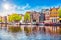 Amsterdam Netherlands dancing houses over river Amstel landmark in old european city spring landscape.