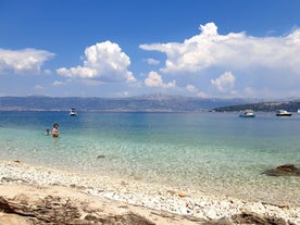 photo of a beautiful panoramic view of Kastel Luksic harbor and landmarks summer view, Split region of Dalmatia, Croatia.