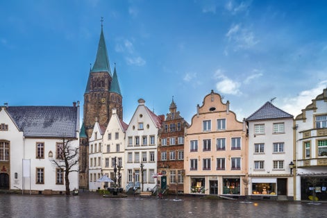 Photo of Market square with beautiful hisyorical houses and church in Warendorf, Germany.
