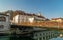 Photo of Butcher bridge with love padlocks, Saint Nicholas Cathedral and Ljubljana castle in the background.