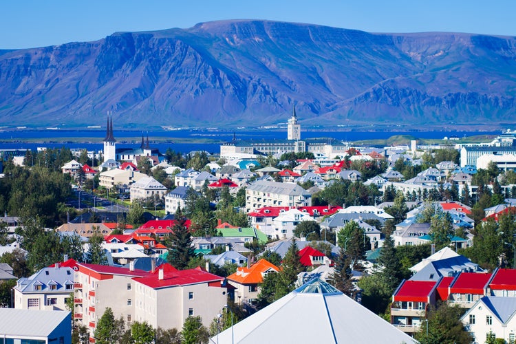 aerial view of Reykjavik, Iceland with harbor and skyline mountains.jpg