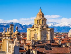 Photo of aerial view of Verona historical city centre, Ponte Pietra bridge across Adige river, Verona Cathedral, Duomo di Verona, red tiled roofs, Veneto Region, Italy.