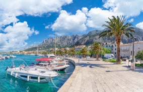 Photo of aerial view on Adriatic Sea and Baska Voda place in Makarska Riviera, Dalmatia region, popular tourist summer resort in Croatia.