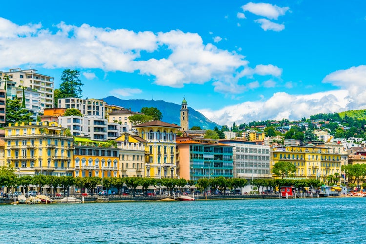 Photo of old town of Lugano facing the Lugano lake in Switzerland.