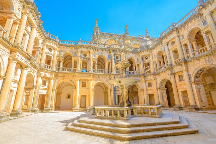 Photo of bottom view of claustro de D. Joao III, courtyard with fountain of Convent of Christ in Templar Castle, Tomar ,Portugal. 