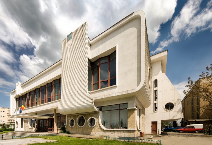 Postmodern train station in Targu Jiu, Romania, a building inspired by Constantin Brancusi modern sculpture.