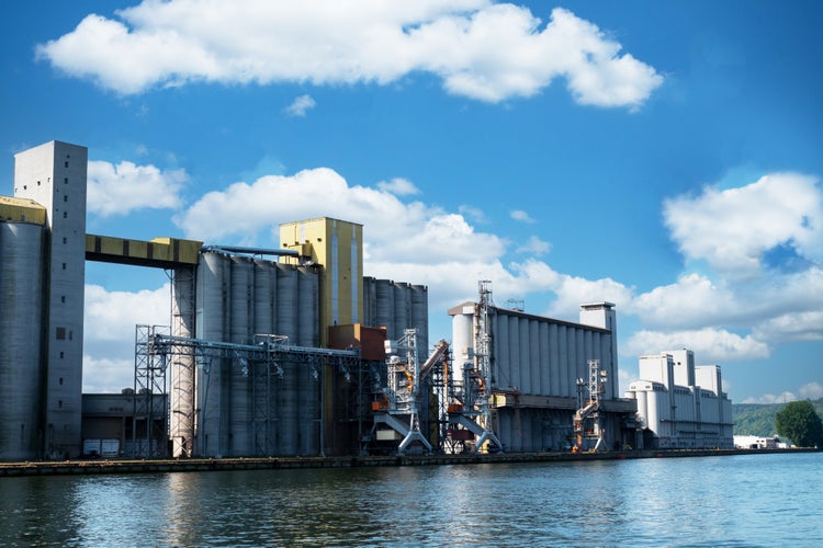 Photo of big grain storage silos in the port of Rouen in France.