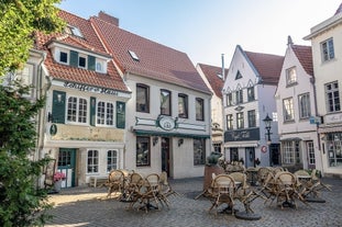 Photo of beautiful panoramic view of historic Bremen Market Square in the center of the Hanseatic City of Bremen with The Schuetting and famous Raths buildings on a sunny day with blue sky in summer, Germany.