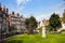 photo of famous historic Begijnhof (Beguinage, 1346) is one of the oldest inner courts in the city of Amsterdam. Begijnhof was founded during the middle Ages. Amsterdam, Netherlands.