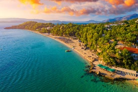 Photo of panoramic aerial view of the popular Platis Gialos beach on the Greek island of Mykonos with turquoise sea, Greece.