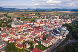 Photo of Lednice Chateau with beautiful gardens and parks on a sunny summer day, Czech Republic.