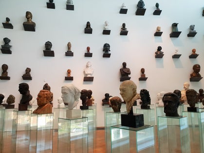 Photo of Kumu museum of Modern Art. Famous historical people bust sculptures.