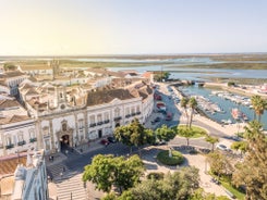 Photo of aerial view of touristic Portimao with wide sandy Rocha beach, Algarve, Portugal.