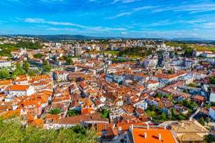 Porto, Portugal old town ribeira aerial promenade view with colorful houses, Douro river and boats.