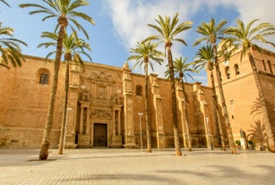 Photo of aerial view of Jaen with cathedral and Sierra Magina mountains on background, Andalusia, Spain.