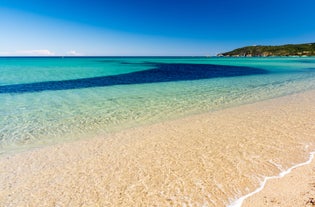 Photo of beautiful aerial view of Saint-Tropez, France with seascape and blue sky.