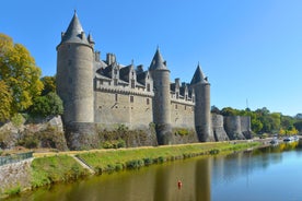 Photo of Vannes, beautiful city in Brittany, boats in the harbor, with typical houses and the cathedral in background, France.