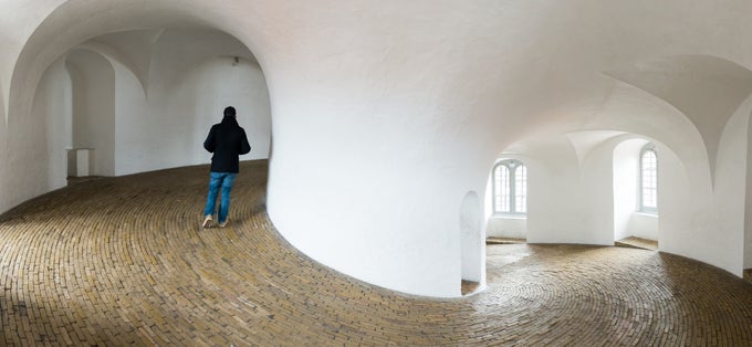 Photo of tourist Walking in Rundetaarn, Copenhagen, Denmark.