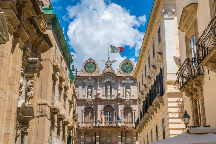 Scenic sight in Trapani old town with the Palazzo Senatorio in the background. Sicily, Italy.