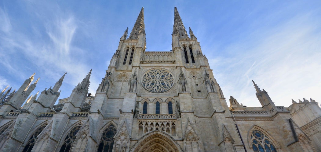 Front facade of Saint-André Cathedral in Bordeaux with detailed Gothic architecture and rose window under blue sky..jpg
