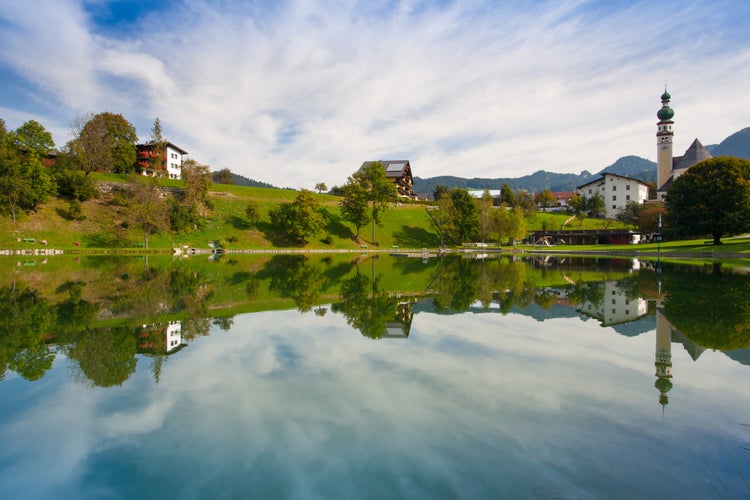 Reflection on the nature swimming pool in Reith, Alpbachtal in Tyrol, Austria.