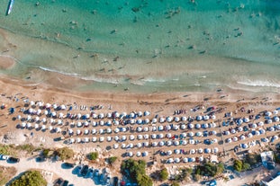 Photo of aerial view on clear blue water of Coral bay in Peyia, Cyprus.