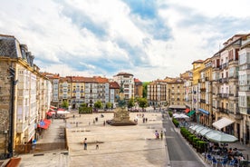 Photo of aerial view of Vizcaya bridge over the river and cityscape at Portugalete, Spain.