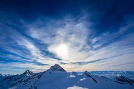 Photo of panorama of Hintertux ski resort in Zillertal Alps in Austria with the far view of ski lifts and pistes.