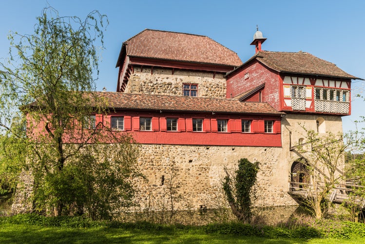 Photo of Front view of Hagenwil Castle, a moated castle near Amriswil in the Canton of Thurgau, Switzerland. It was built at the beginning of the 13th century.