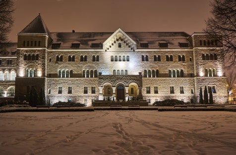 The Neo-Romanesque building of the Imperial Castle at night in Poznan