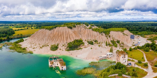 Photo of aerial view of the Rummu abandoned prison Tallinn Estonia lake beach.