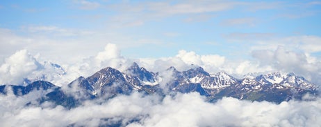 photo of an aerial view of Innsbruck, Austria during the winter morning, with snow and mountains at the background.