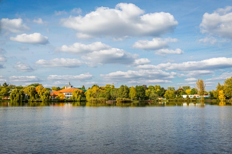 photo of view of Panoramic view of amazing landscape with a lake and blue sky with white clouds. Salt lake (Sosto) Nyiregyhaza, Hungary