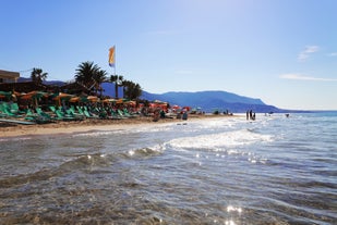 Photo of aerial view of Malia beach and small island with Church of Transfiguration, Heraklion, Crete, Greece.