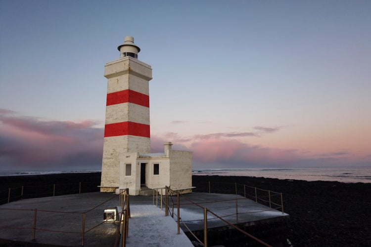 photo of view The old lighthouse in Gardur at Reykjanes Peninsula Iceland in winter, Southern Peninsula, Iceland.