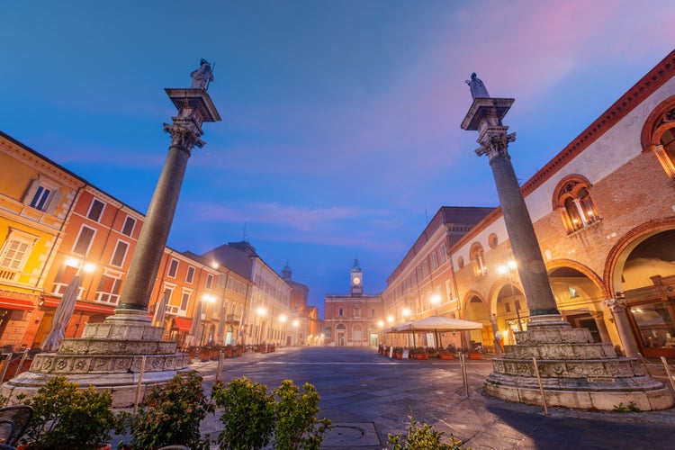 photo of  view  of Ravenna, Italy at Piazza del Popolo with the landmark Venetian columns at dusk.