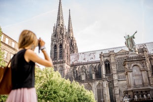 Photo of panoramic view of the city of Clermont-Ferrand with its cathedral, France.