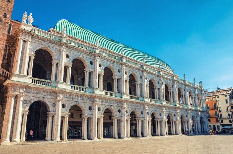 Photo of Basilica Palladiana renaissance building with balconies and columns in Piazza dei Signori square in old historical city centre of Vicenza city, Veneto region, Italy.