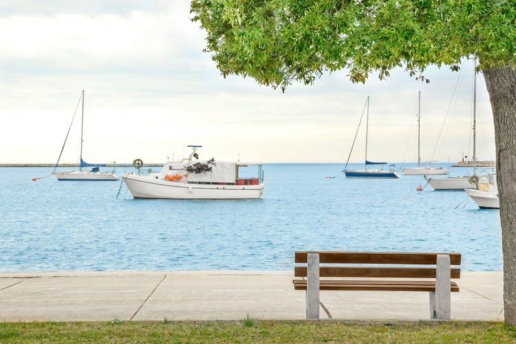 Umag croatia.beautiful promenade by the sea with a view of fishing boats.Mediterranean tourist destination.