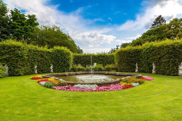 PHOTO OF Fountain in a park in Trier in a beautiful summer day, Germany.