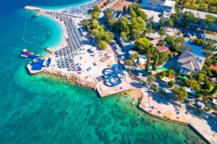 Photo of aerial view of Historic Adriatic town of Krk aerial view, Island of Krk, Kvarner bay of Croatia.