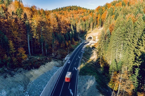 Aerial drone view of mountain overpass and modern road with tunnel Karaula in Bosnia and Herzegovina. Connection between Sarajevo and Tuzla. Toned image.