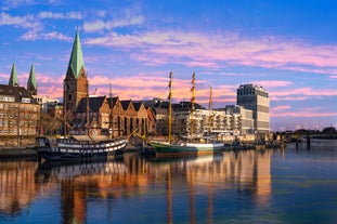 Photo of beautiful panoramic view of historic Bremen Market Square in the center of the Hanseatic City of Bremen with The Schuetting and famous Raths buildings on a sunny day with blue sky in summer, Germany.