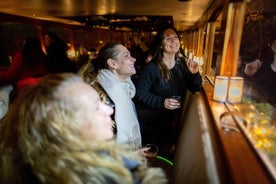 Cruzeiro noturno pelos canais de Amsterdã com guia ao vivo e bar a bordo