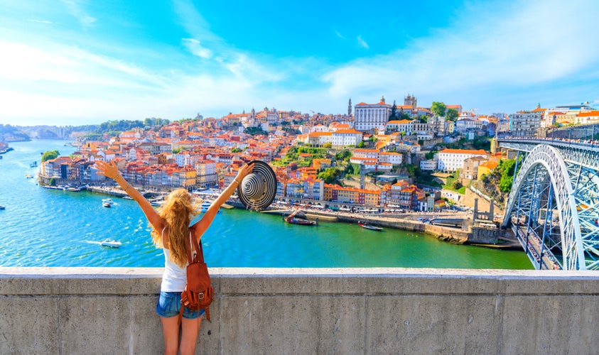 Photo of cityscape panoramic view of Happy traveler woman in Porto, Portugal.