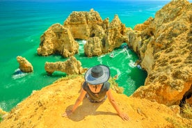 Photo of Carvoeiro fishing village with beautiful beach and colourful houses, Portugal.