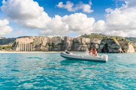 photo of an aerial view of Parghelia in Italy. Overview of seabed seen from above, transparent water and beach with umbrellas.